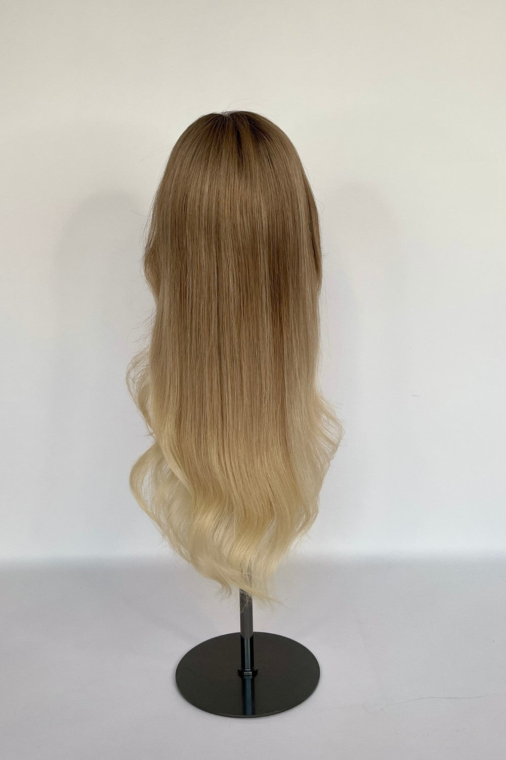 BHBD full och half lace wig in an ash blonde ombré shade, transitioning to soft, light blonde waves. Made with 100% real Remy hair, offering a natural parting and seamless styling versatility.