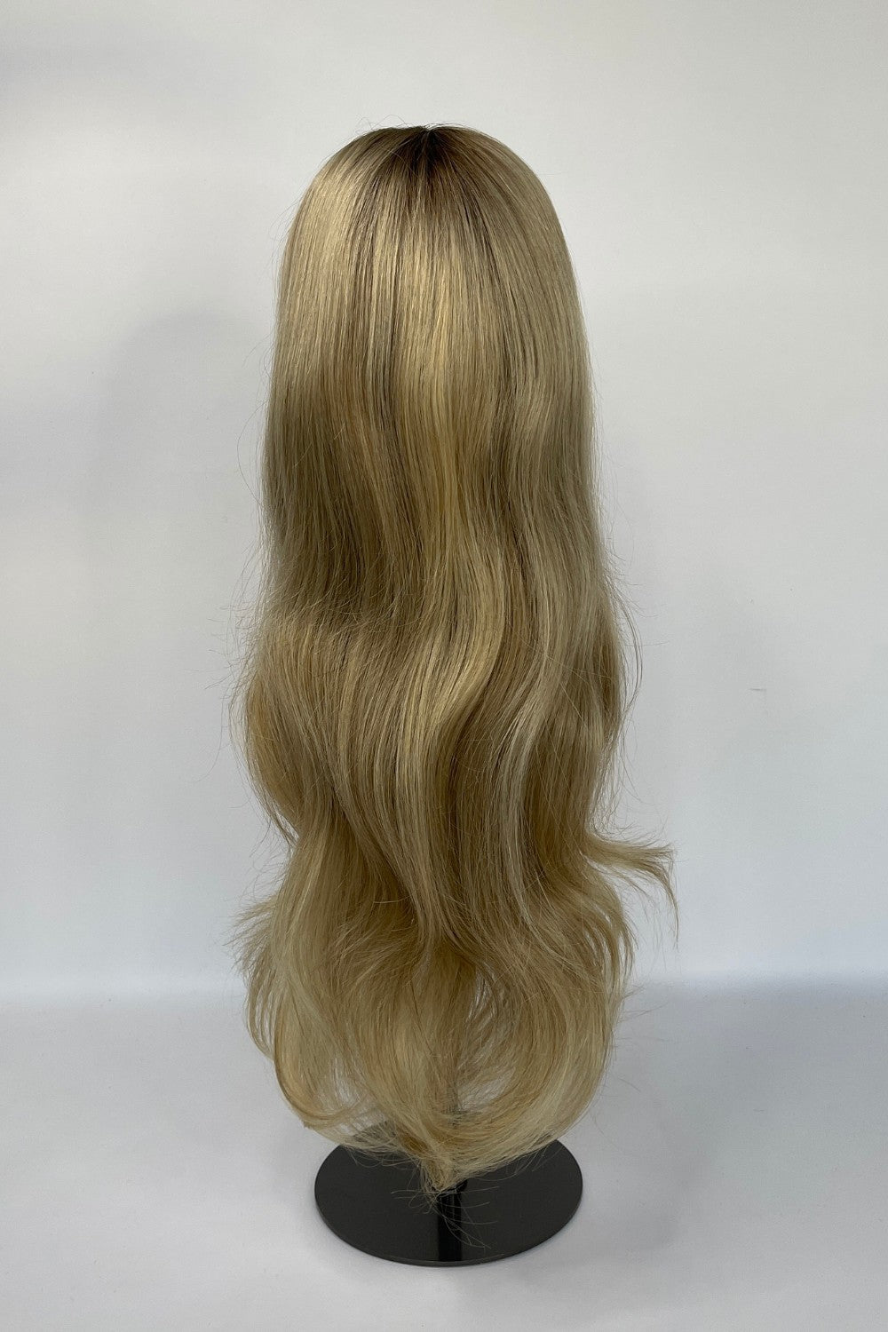 BHBD lace wig in a sandy blonde ombré shade with long, flowing waves. Made with 100% real Remy hair, offering a natural parting and seamless fit for versatile styling.