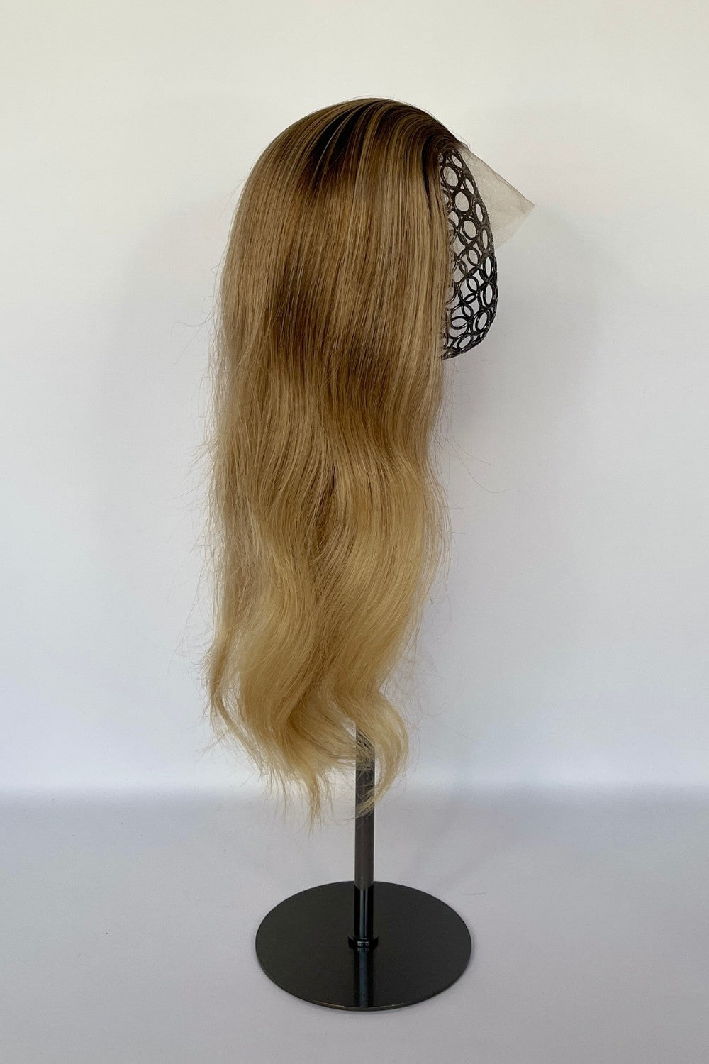 BHBD HD-lace wig in a honey blonde ombré shade with long, flowing waves. Made with 100% real Remy hair, providing a natural parting and seamless versatility for styling