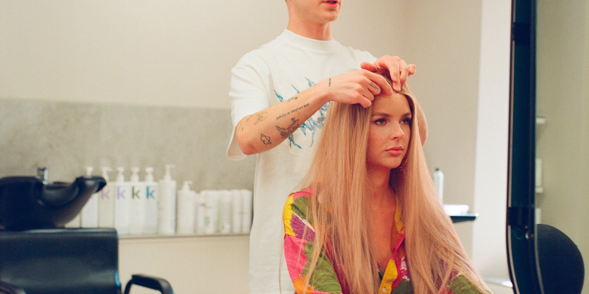 Woman getting her hair styled at a salon.